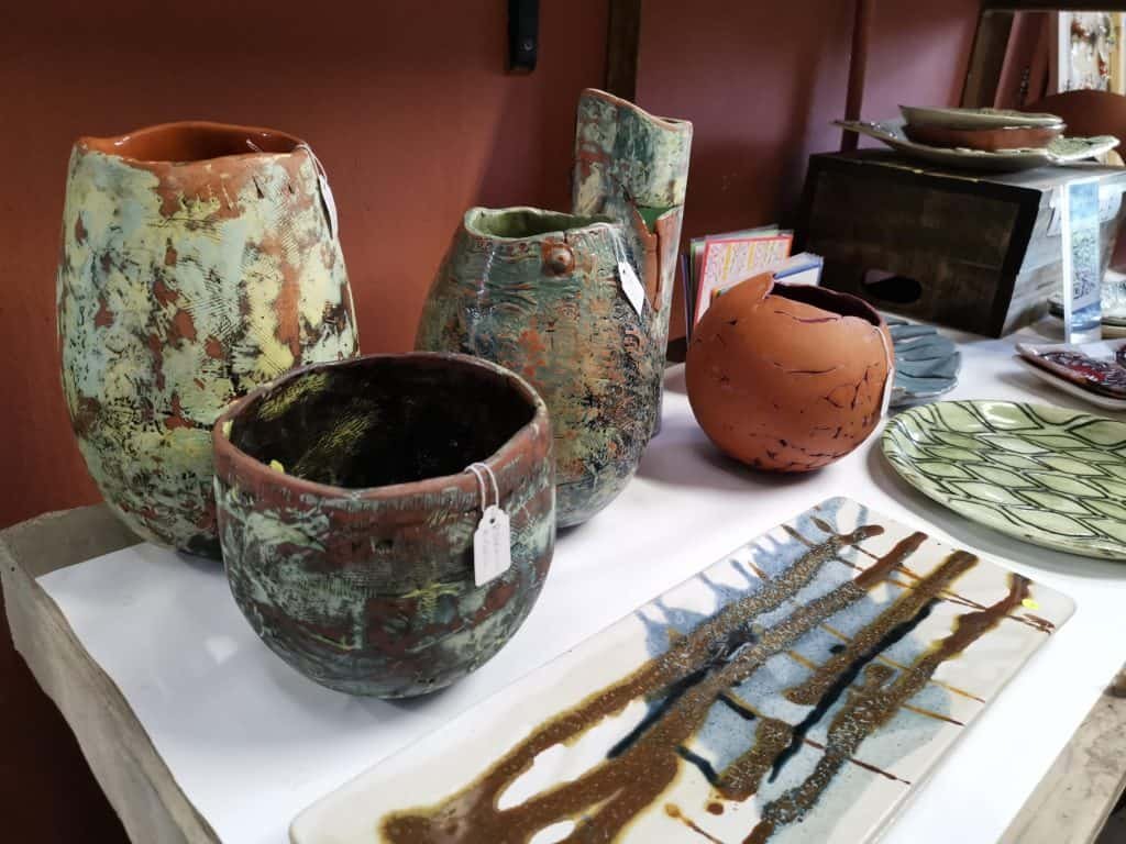 Heather Colin's Pots behind Sandy Goercke's platters.