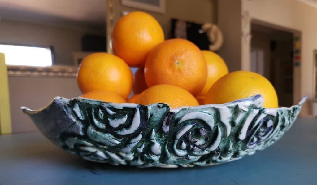 pottery handwork with oranges and roses